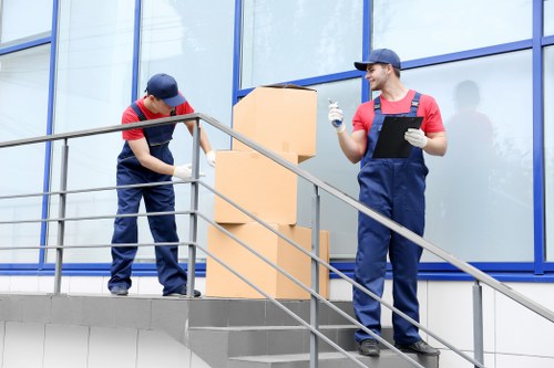 Removal team loading household items into a vehicle