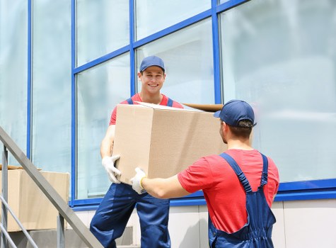 Man with a van loading furniture in Knightsbridge