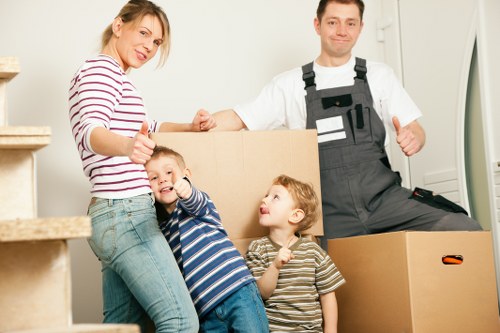 Office furniture and packed business equipment ready for commercial removals